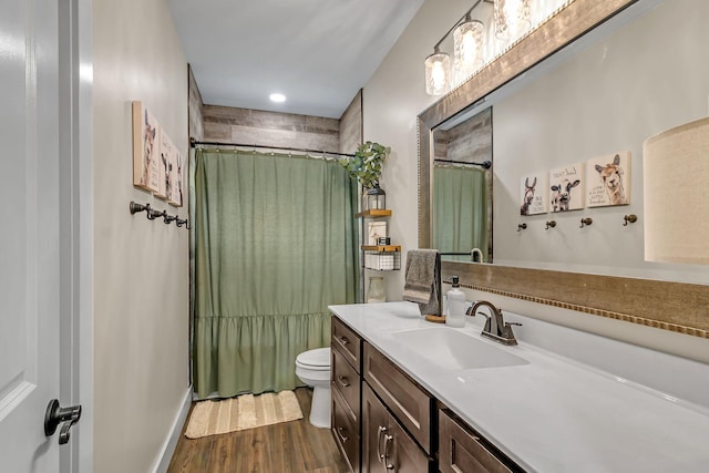 full bath featuring recessed lighting, vanity, toilet, wood finished floors, and a shower with shower curtain