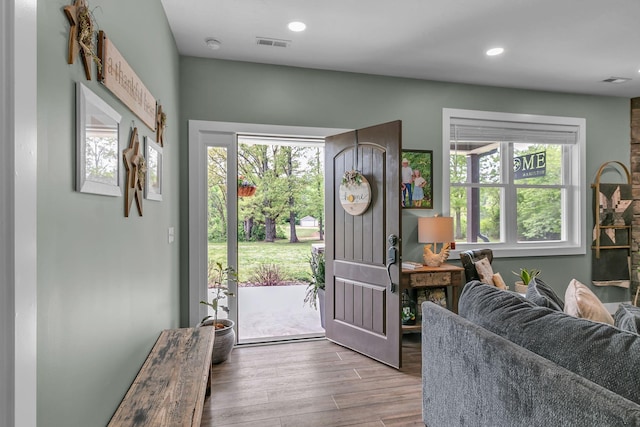 entryway with recessed lighting, visible vents, wood finished floors, and a healthy amount of sunlight