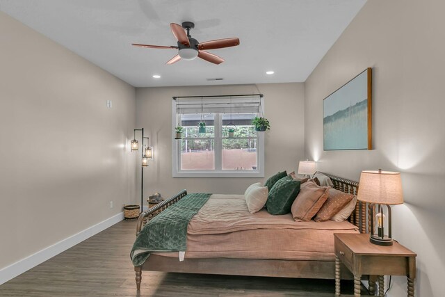 bedroom with baseboards, recessed lighting, wood finished floors, and ceiling fan