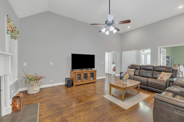 living area with recessed lighting, a ceiling fan, high vaulted ceiling, and wood finished floors