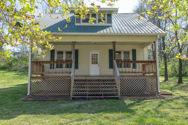 1328 N Springs Rd, Red Boiling Springs, TN 37150 - view of front of home with covered porch, metal roof, and a front lawn
