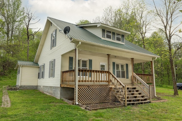 1328 N Springs Rd, Red Boiling Springs, TN 37150 - rear view of property with metal roof, a lawn, covered porch, and stairs
