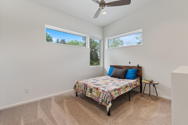 bedroom featuring ceiling fan, carpet, and baseboards