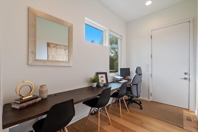 office featuring baseboards, recessed lighting, and light wood-style floors