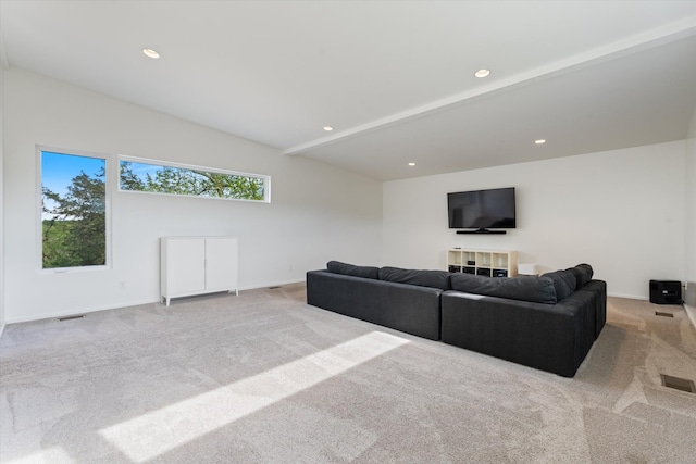 living area with baseboards, visible vents, and carpet flooring