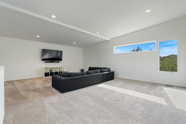 carpeted living area featuring baseboards, recessed lighting, visible vents, and lofted ceiling