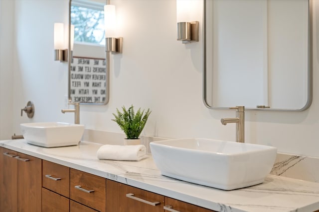 bathroom with double vanity and a sink