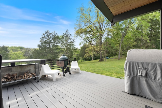 wooden deck featuring a yard