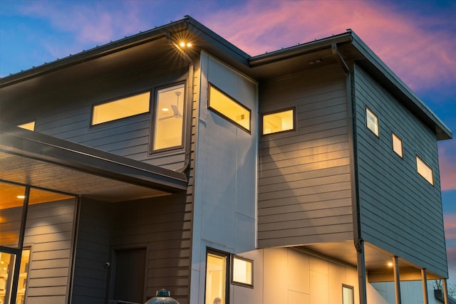 view of property exterior at dusk
