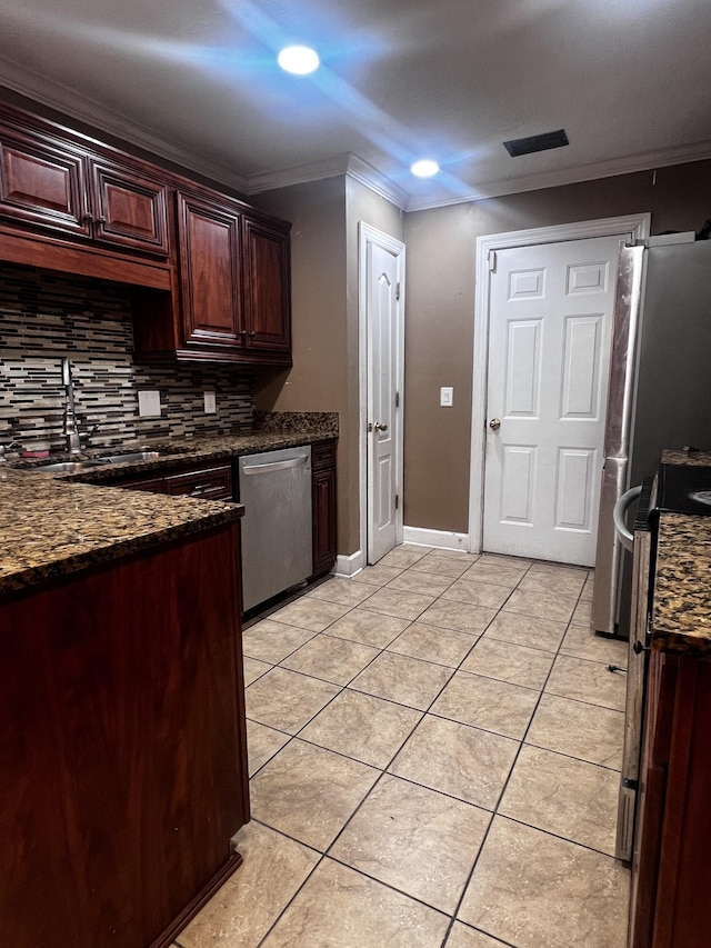 914 Lavergne Ln, La Vergne, TN 37086 - kitchen featuring decorative backsplash, crown molding, a sink, appliances with stainless steel finishes, and light tile patterned flooring