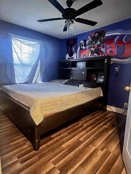 914 Lavergne Ln, La Vergne, TN 37086 - bedroom with a ceiling fan and wood finished floors