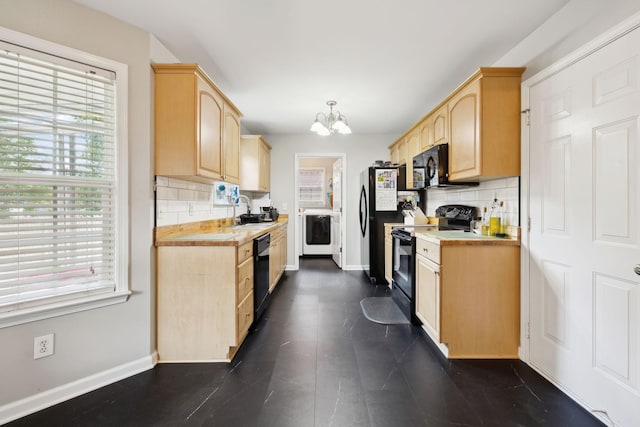 108 Braley Ct, Murfreesboro, TN 37129 - kitchen featuring black appliances, light brown cabinets, washer / dryer, light countertops, and a chandelier
