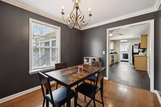 108 Braley Ct, Murfreesboro, TN 37129 - dining room featuring a chandelier, crown molding, and dark wood-type flooring