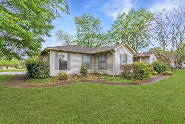 view of side of home featuring a lawn