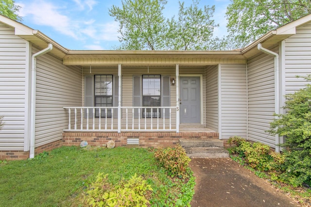 entrance to property with covered porch