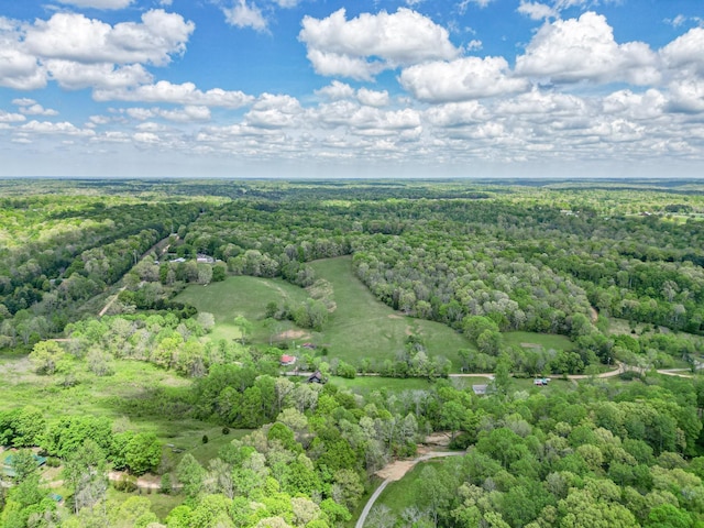 birds eye view of property featuring a wooded view