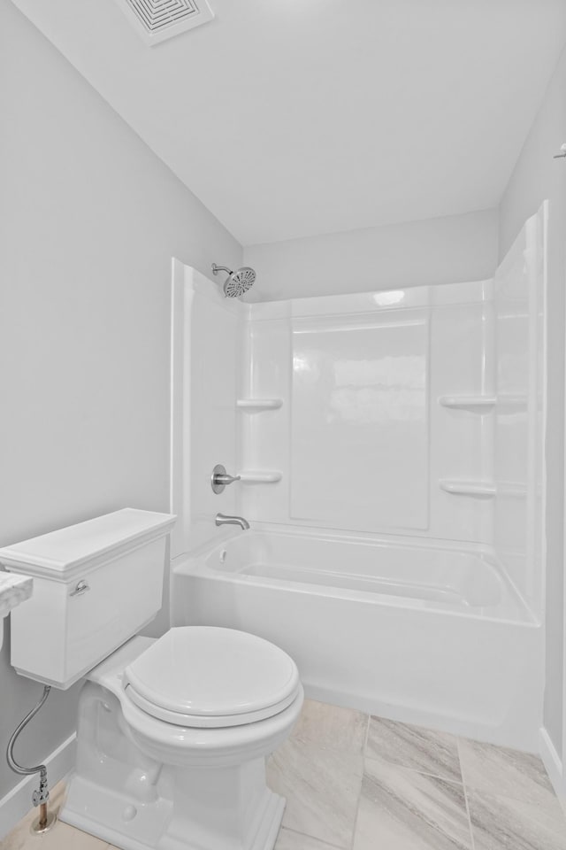 full bath with visible vents, toilet,  shower combination, and baseboards