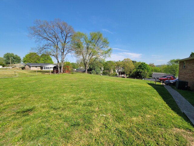 view of yard with central air condition unit