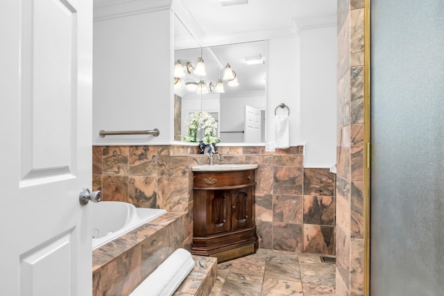full bathroom with a bath, an inviting chandelier, crown molding, and vanity