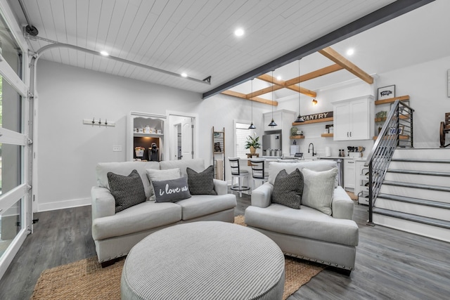 living room with beamed ceiling, baseboards, dark wood-style flooring, recessed lighting, and stairs