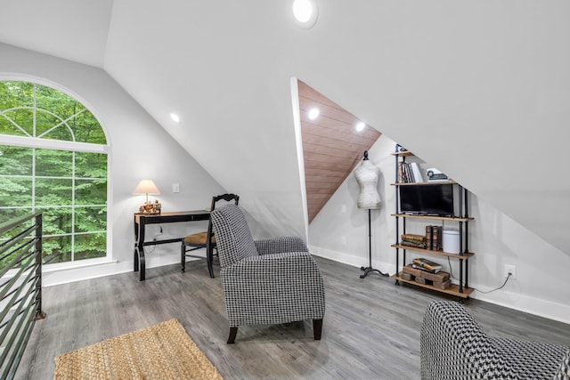 sitting room with wood finished floors, lofted ceiling, and baseboards
