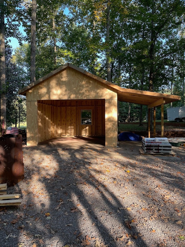 exterior space featuring an outbuilding and a carport