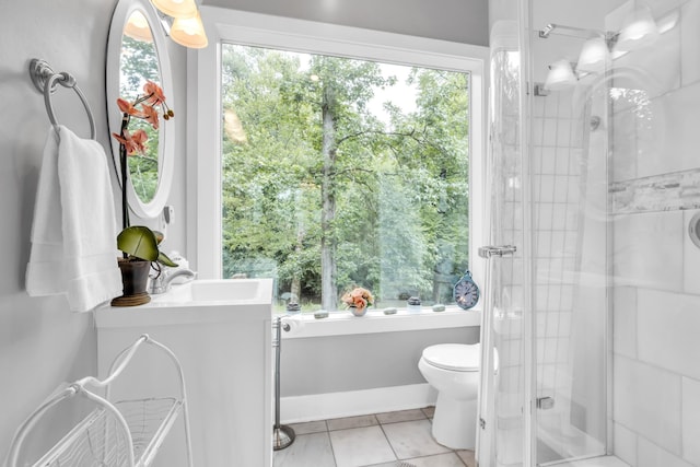 full bathroom with toilet, a stall shower, a wealth of natural light, and tile patterned floors