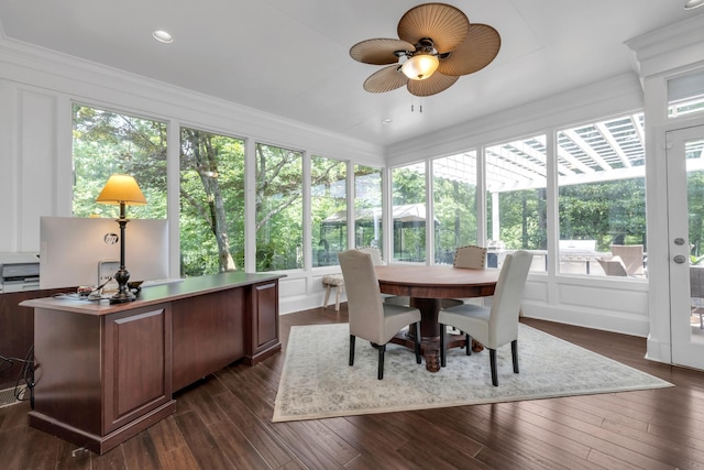 sunroom / solarium featuring a deck, a wealth of natural light, and wood finished floors