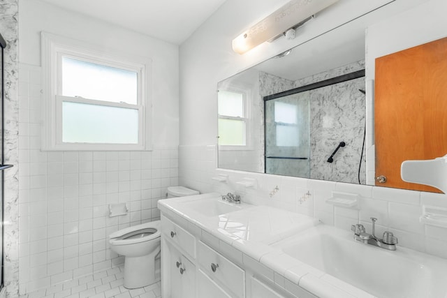 913 Branch Rd, Clarksville, TN 37043 - full bathroom with tile walls, a sink, a shower stall, toilet, and double vanity