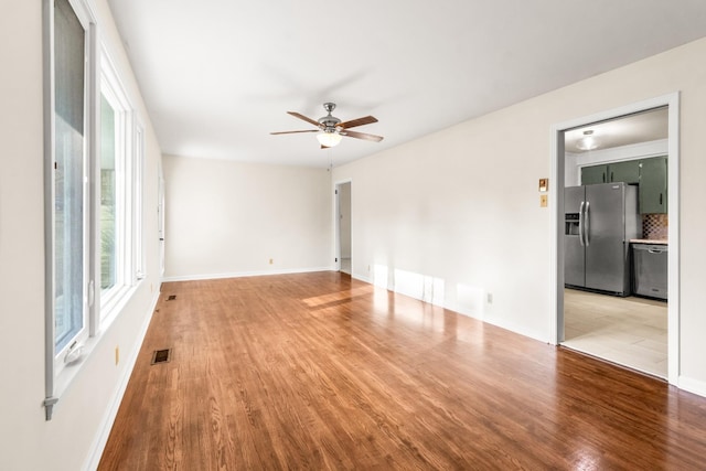 913 Branch Rd, Clarksville, TN 37043 - spare room with visible vents, ceiling fan, wood finished floors, and baseboards