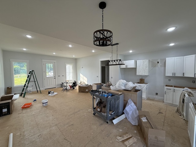 176 Beartown Rd, Loretto, TN 38469 - kitchen featuring white cabinets, recessed lighting, hanging light fixtures, and baseboards