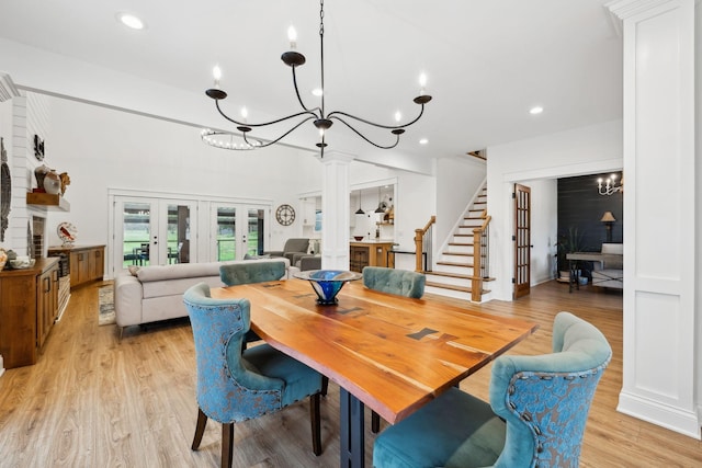dining room featuring recessed lighting, stairway, a chandelier, and light wood-style floors