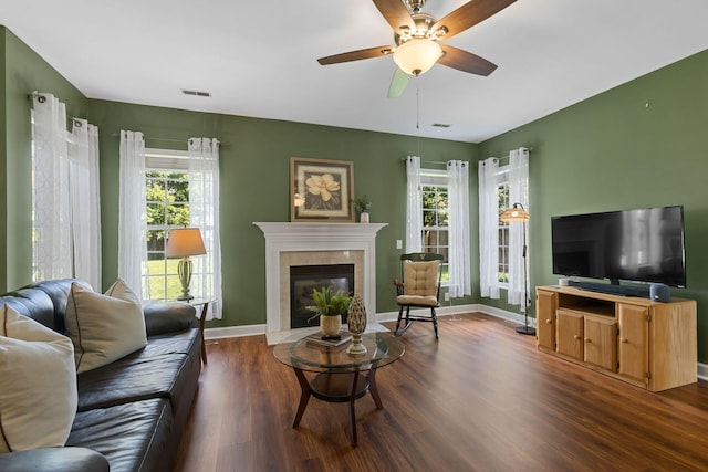 1320 Autumn Springs Ln, Old Hickory, TN 37138 - living area with dark wood-style flooring, a glass covered fireplace, ceiling fan, and baseboards