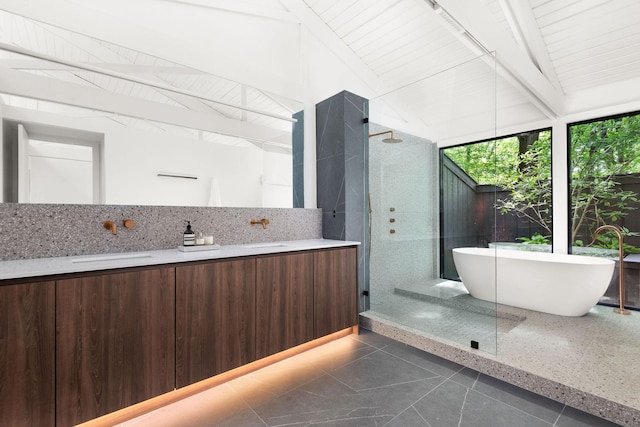5040 Villa Crest Dr, Nashville, TN 37220 - full bathroom with beam ceiling, tiled shower, a freestanding bath, tile patterned floors, and decorative backsplash