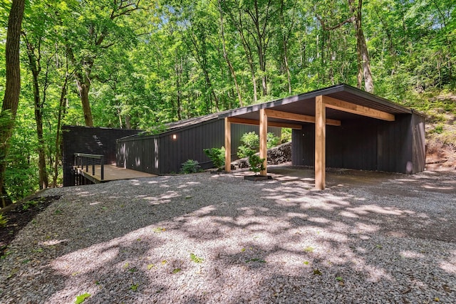 5040 Villa Crest Dr, Nashville, TN 37220 - view of yard with a pole building, a detached carport, a forest view, and an outdoor structure