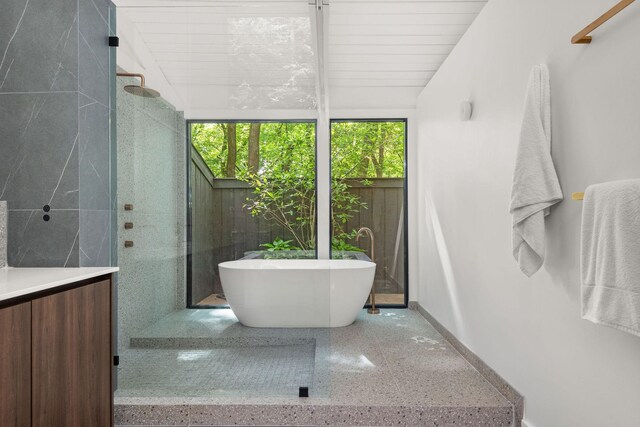 5040 Villa Crest Dr, Nashville, TN 37220 - bathroom featuring a freestanding bath, baseboards, and a tile shower