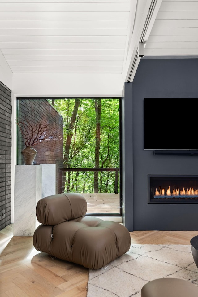 5040 Villa Crest Dr, Nashville, TN 37220 - living room featuring plenty of natural light, a lit fireplace, and wood finished floors