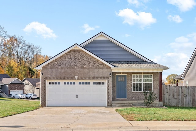 223 Casting Ct, Clarksville, TN 37043 - ranch-style house with a front lawn, brick siding, concrete driveway, an attached garage, and fence