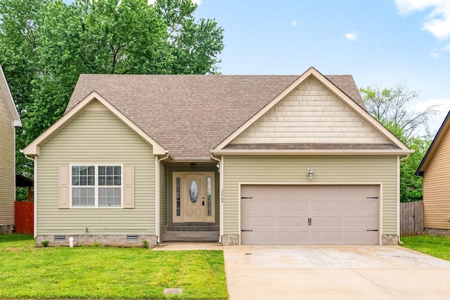 ranch-style home featuring a front lawn, crawl space, roof with shingles, concrete driveway, and an attached garage