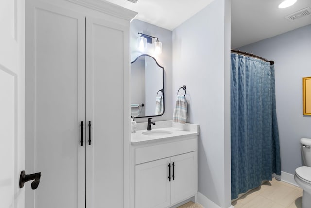 full bathroom featuring vanity, toilet, visible vents, baseboards, and tile patterned flooring