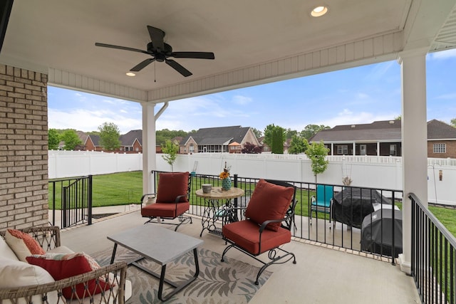 view of patio with ceiling fan, a residential view, and a fenced backyard
