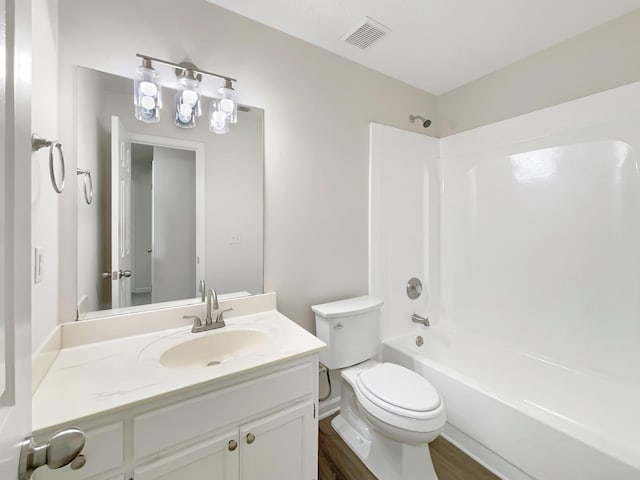 616 Hardin Shire Dr, Old Hickory, TN 37138 - bathroom with visible vents, toilet, wood finished floors, vanity, and bathtub / shower combination