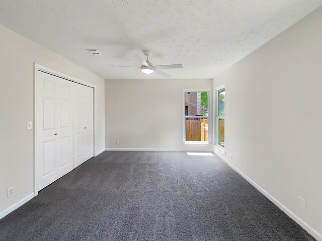 616 Hardin Shire Dr, Old Hickory, TN 37138 - unfurnished bedroom with ceiling fan, visible vents, dark colored carpet, baseboards, and a textured ceiling
