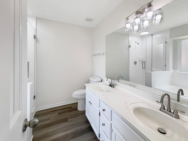 616 Hardin Shire Dr, Old Hickory, TN 37138 - bathroom featuring wood finished floors, toilet, a stall shower, and a sink