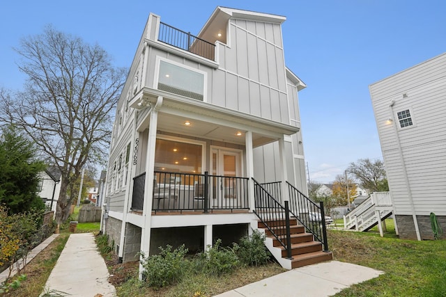 6206B Morrow Rd, Nashville, TN 37209 - view of front of property featuring board and batten siding, stairs, a balcony, fence, and a porch
