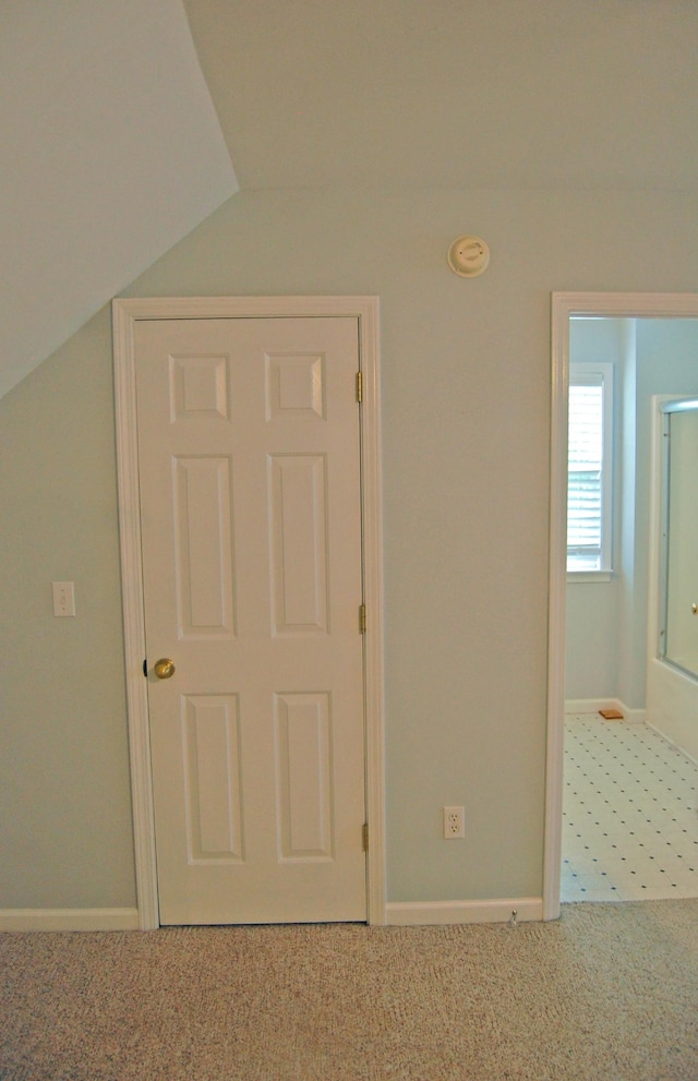547 Grindstone Hollow Rd, Dickson, TN 37055 - unfurnished bedroom featuring carpet, vaulted ceiling, and baseboards