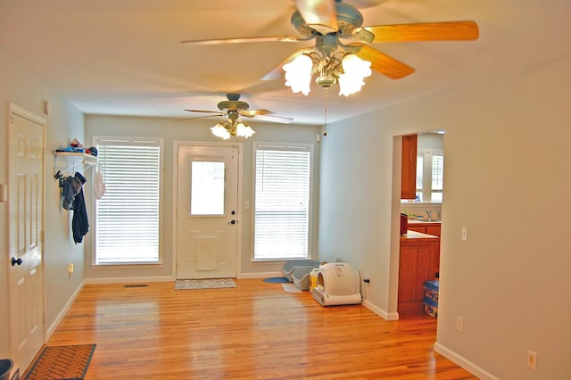547 Grindstone Hollow Rd, Dickson, TN 37055 - entrance foyer with light wood-style floors, ceiling fan, and baseboards