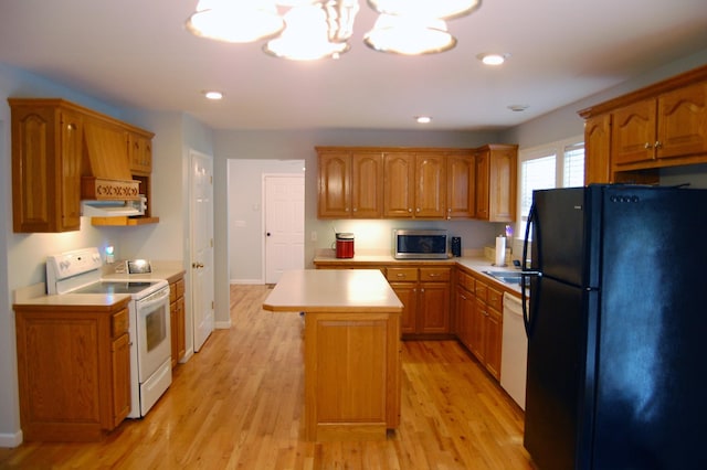 547 Grindstone Hollow Rd, Dickson, TN 37055 - kitchen featuring white appliances, light countertops, light wood-type flooring, brown cabinetry, and recessed lighting