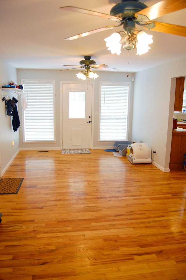 547 Grindstone Hollow Rd, Dickson, TN 37055 - foyer entrance featuring ceiling fan, baseboards, and light wood finished floors