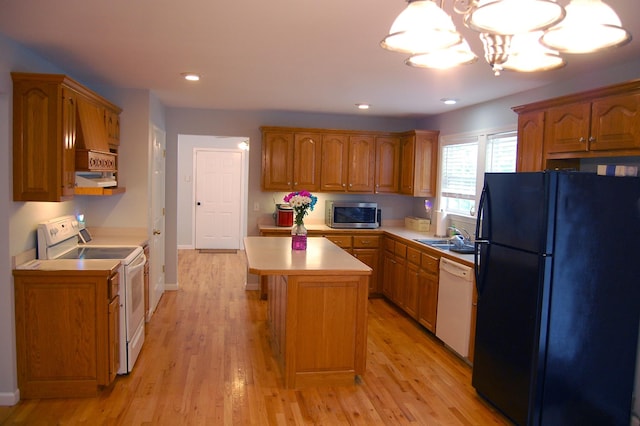 547 Grindstone Hollow Rd, Dickson, TN 37055 - kitchen with white appliances, light countertops, a sink, a chandelier, and light wood-style flooring